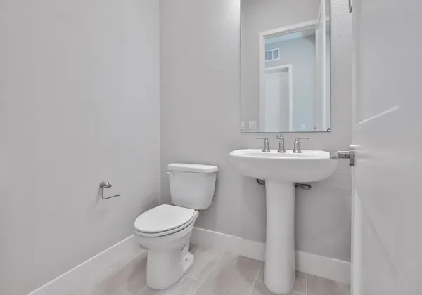 a utility room with sink dryer and washer