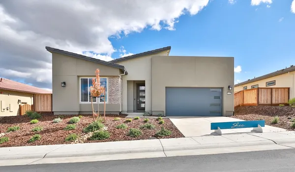 a large kitchen with kitchen island a sink table and chairs