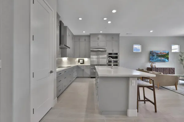 a kitchen with counter top space cabinets and stainless steel appliances