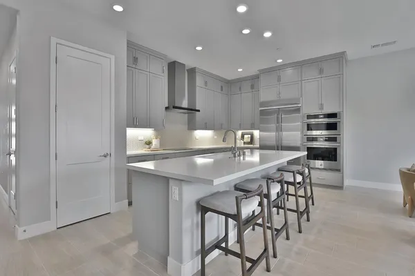 a view of a a dining room with furniture and wooden floor