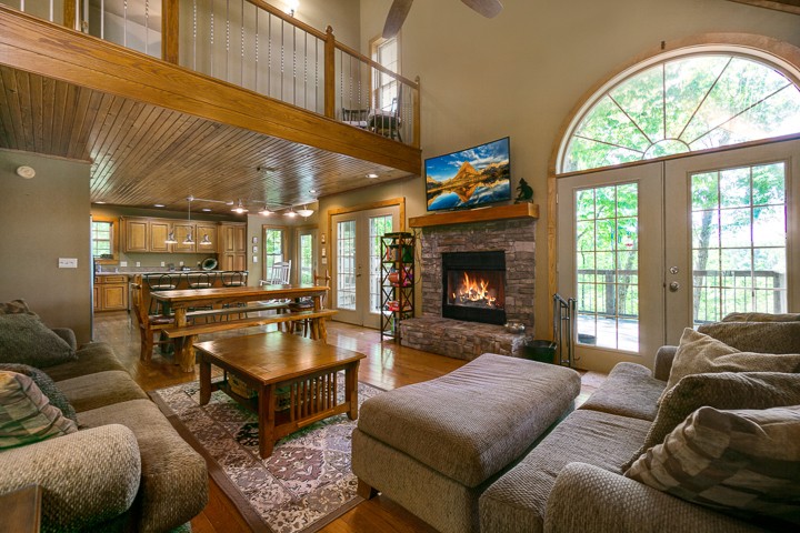 405 Rocky Top Road Sparta, TN 38583 - Photo 1 of 41 a living room with furniture a fireplace and a large window