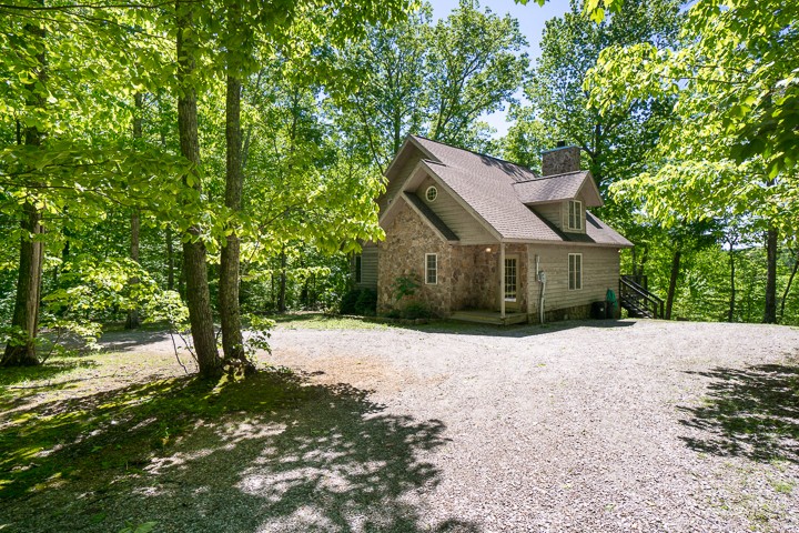 405 Rocky Top Road Sparta, TN 38583 - Photo 3 of 41 a front view of a house with a yard