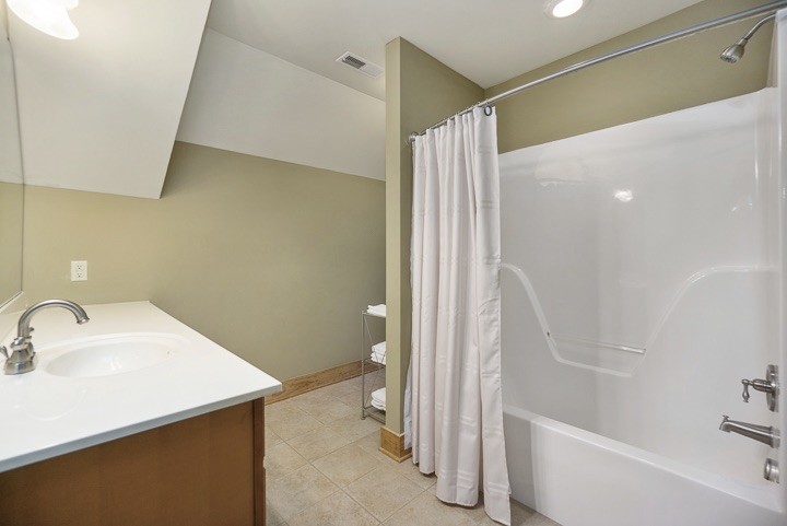 405 Rocky Top Road Sparta, TN 38583 - Photo 29 of 41 a bathroom with a sink and a shower