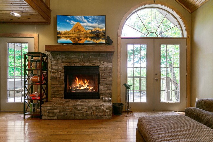 405 Rocky Top Road Sparta, TN 38583 - Photo 7 of 41 a living room with furniture a fireplace and a large window