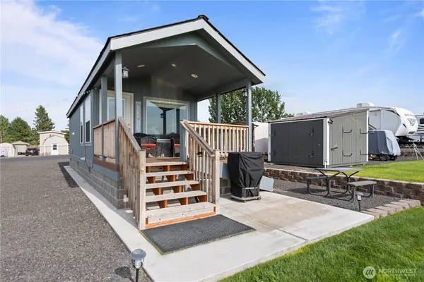 a view of a house with tub and chairs
