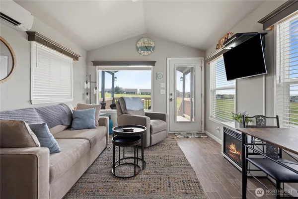 a living room with furniture and a window