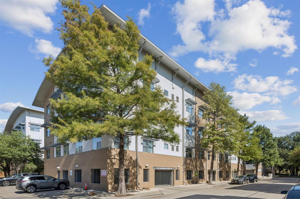 3015 Bryan Street, Unit 3B Dallas, TX 75204 - Photo 15 of 19 a city street lined with buildings and trees