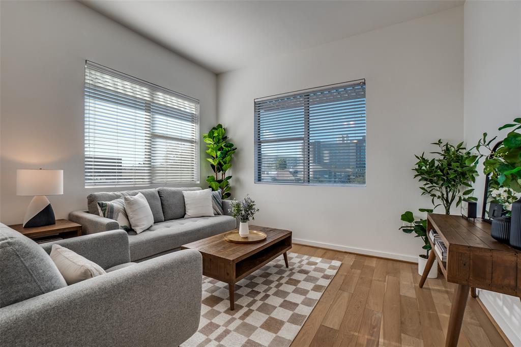 3015 Bryan Street, Unit 3B Dallas, TX 75204 - Photo 2 of 19 a living room with furniture and a potted plant