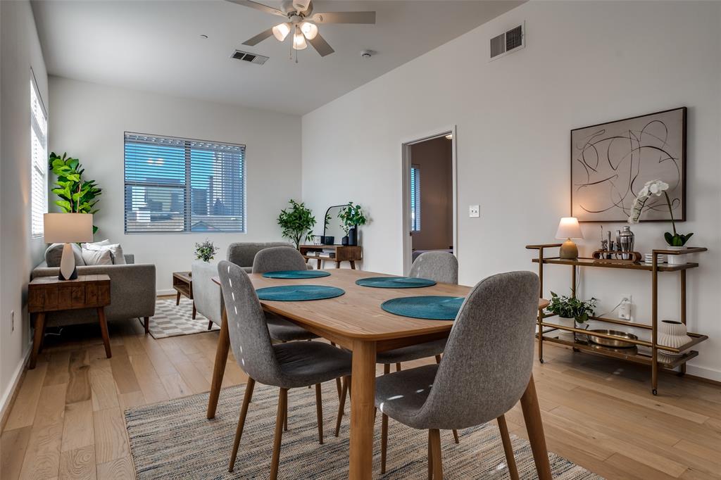 3015 Bryan Street, Unit 3B Dallas, TX 75204 - Photo 5 of 19 a view of a dining room with furniture and wooden floor