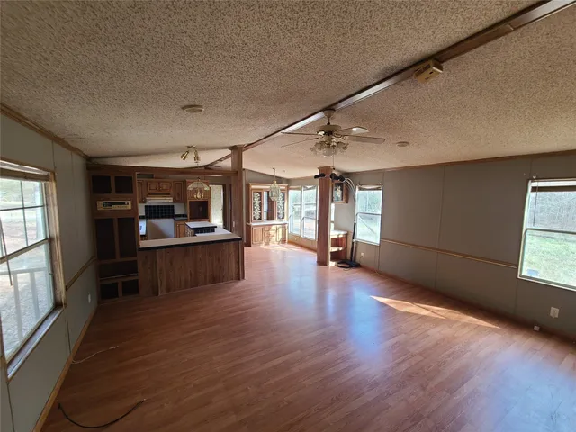 a view of kitchen with furniture and window