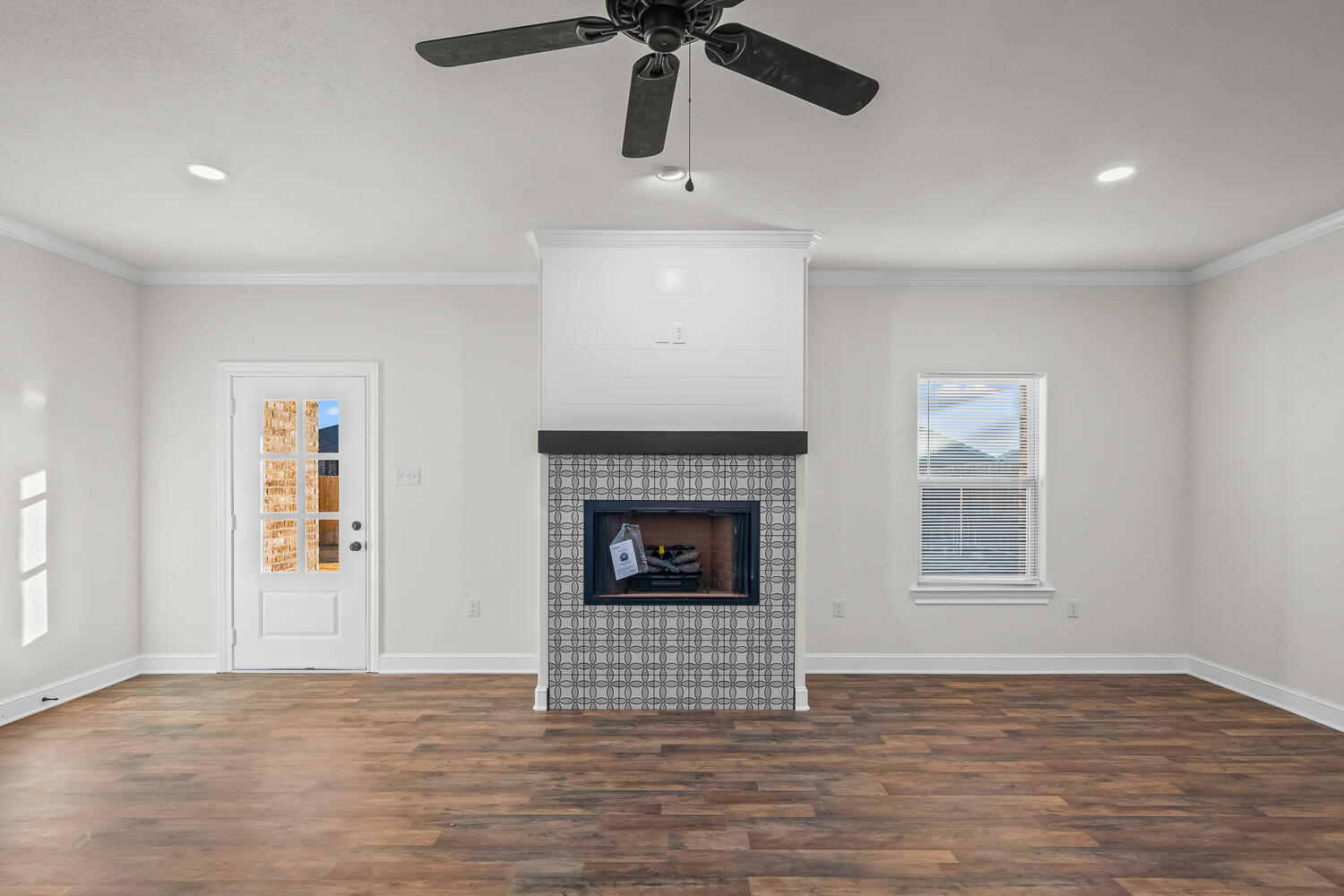 6923 17th Street Lubbock, TX 79416 - Photo 16 of 34 a view of a livingroom with a fireplace and window
