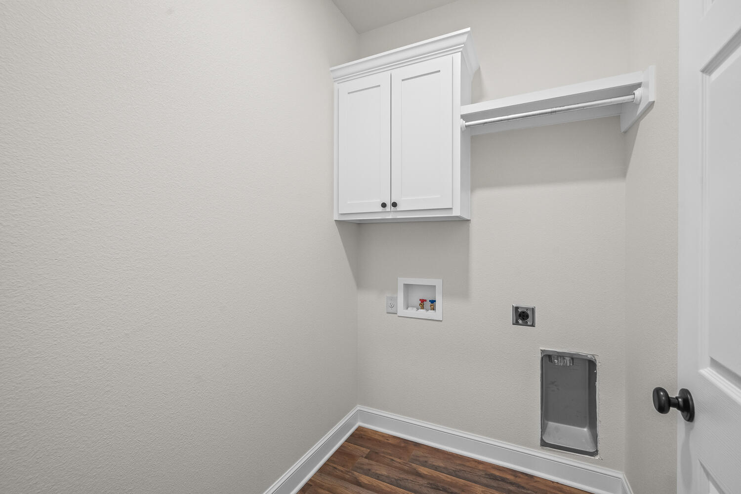 6923 17th Street Lubbock, TX 79416 - Photo 18 of 34 a view of storage and utility room with wooden floor