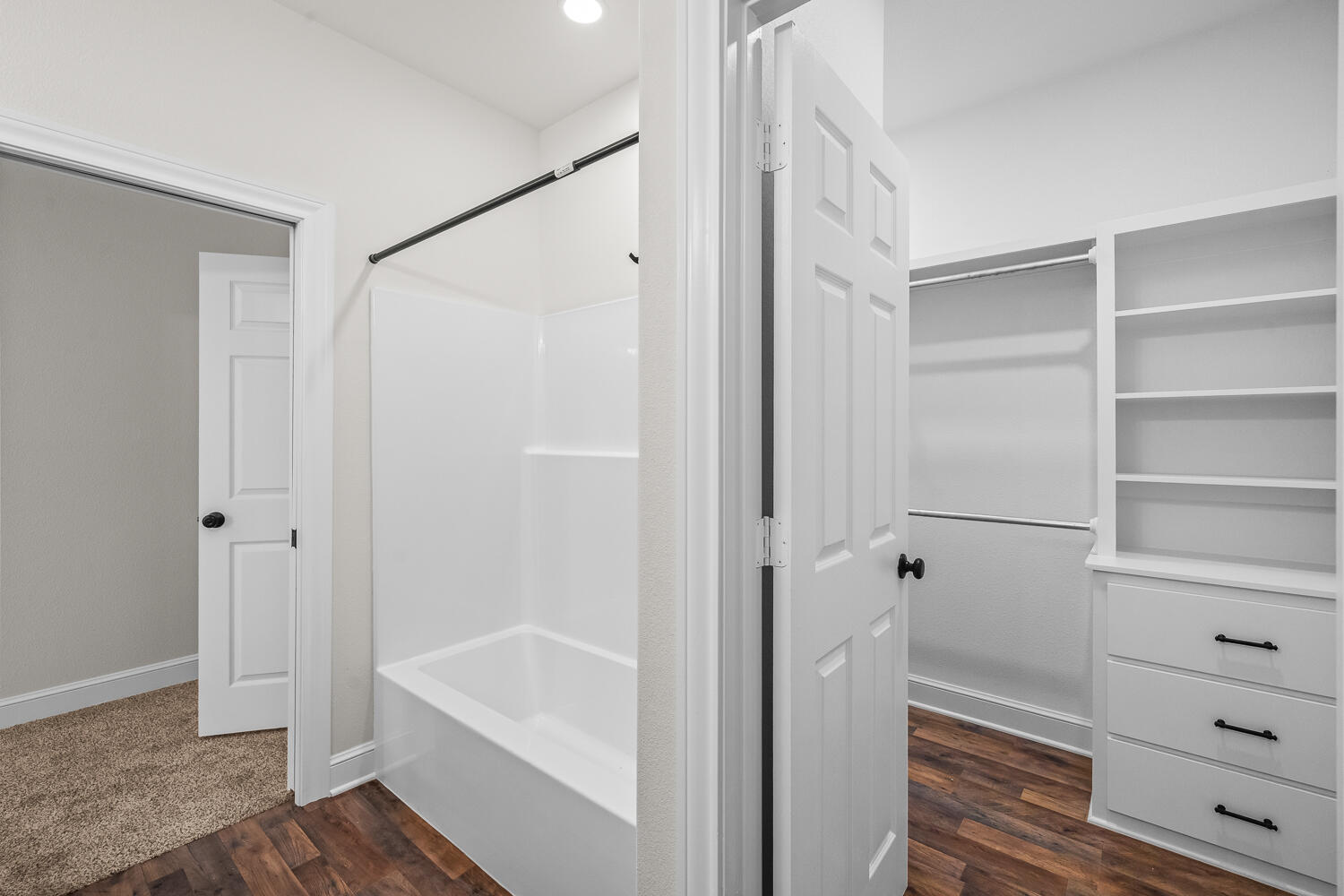 6923 17th Street Lubbock, TX 79416 - Photo 23 of 34 a bathroom with a bathtub and a shower