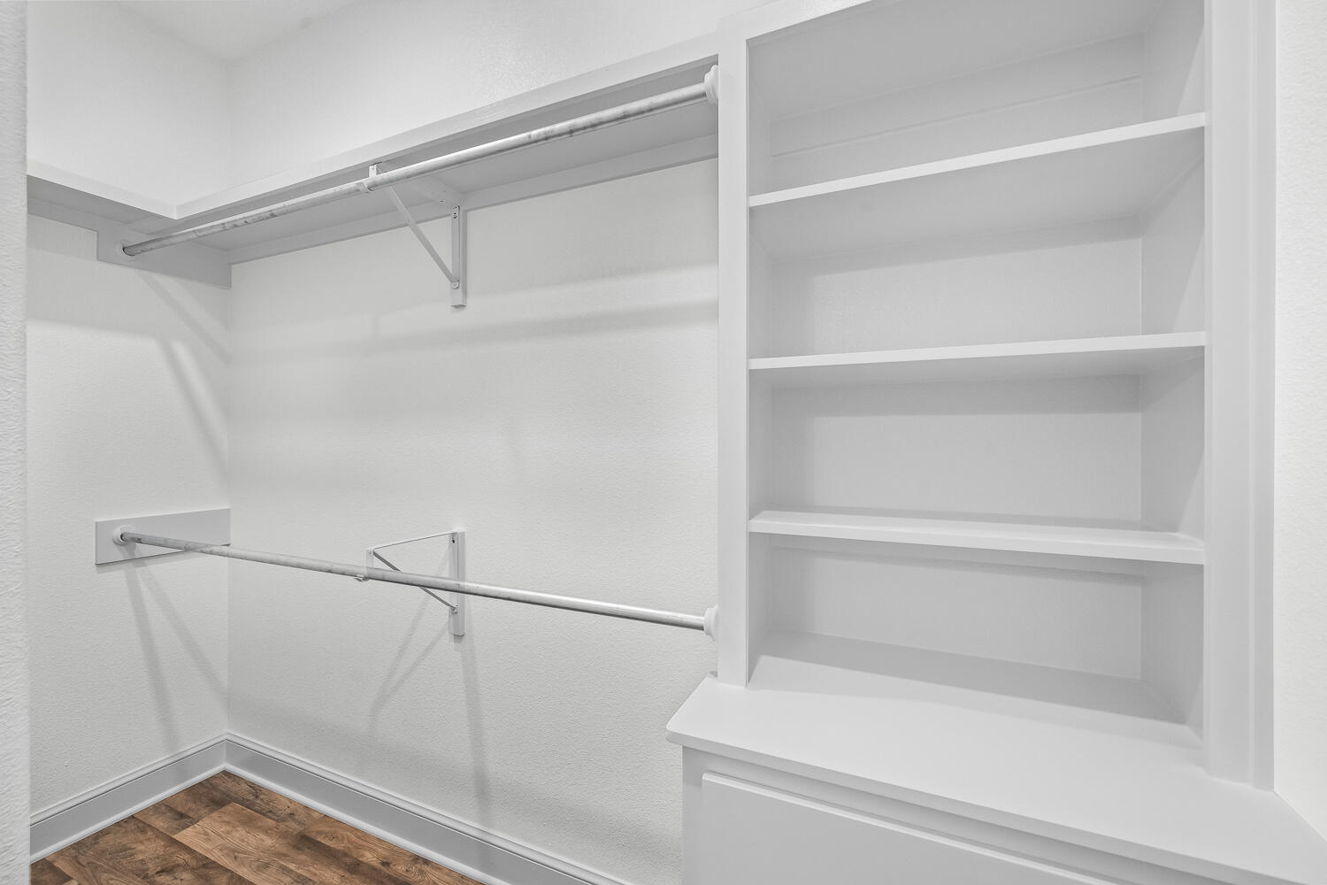 6923 17th Street Lubbock, TX 79416 - Photo 24 of 34 a view of walk in closet with empty racks