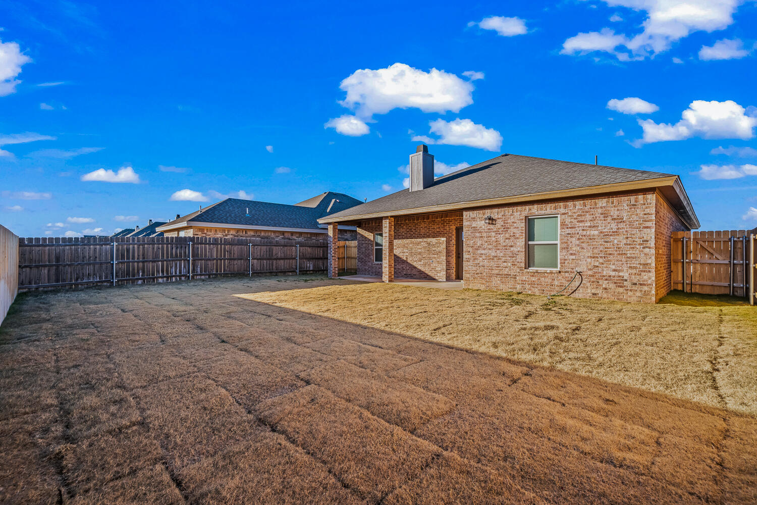6923 17th Street Lubbock, TX 79416 - Photo 34 of 34 a view of a house with a backyard