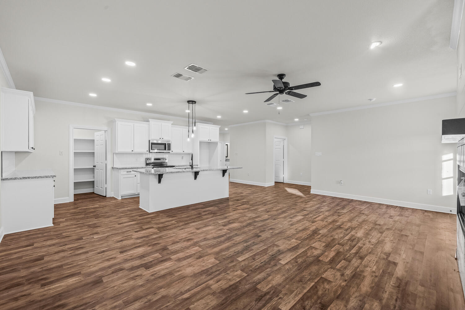 6923 17th Street Lubbock, TX 79416 - Photo 10 of 34 a view of kitchen with wooden floor and window