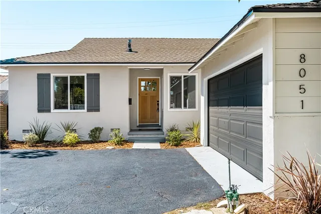 a front view of a house with patio