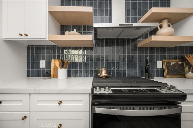 a kitchen with a stove and a microwave