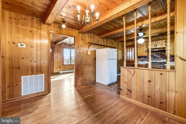 a view of a room with wooden floor and stairs