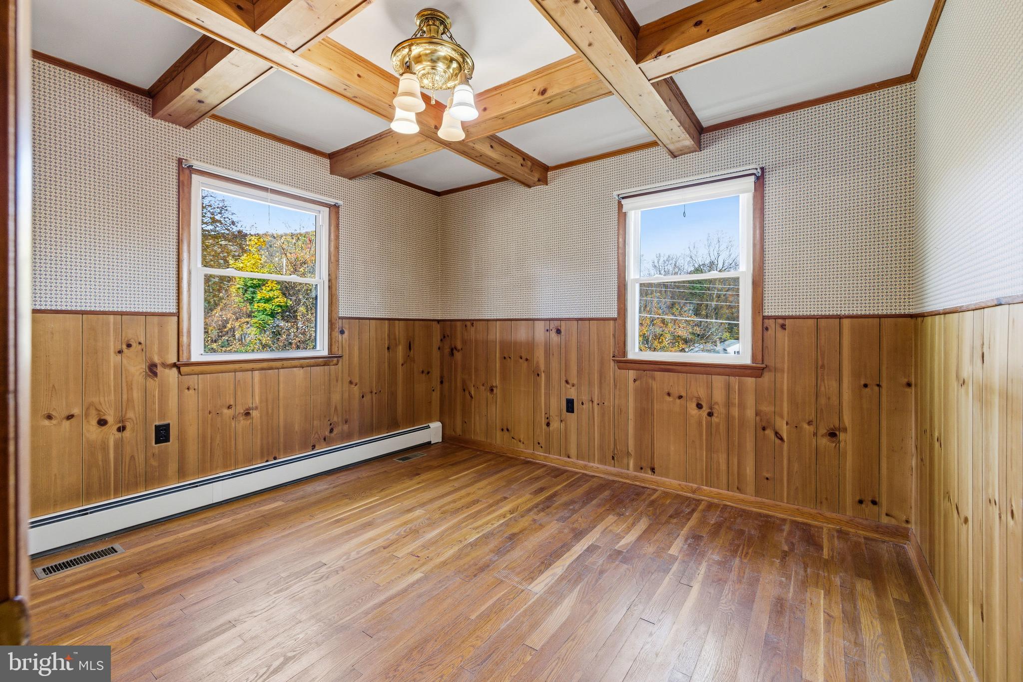 27 Atkins Road Sperryville, VA 22740 - Photo 23 of 76 an empty room with wooden floor closet and windows