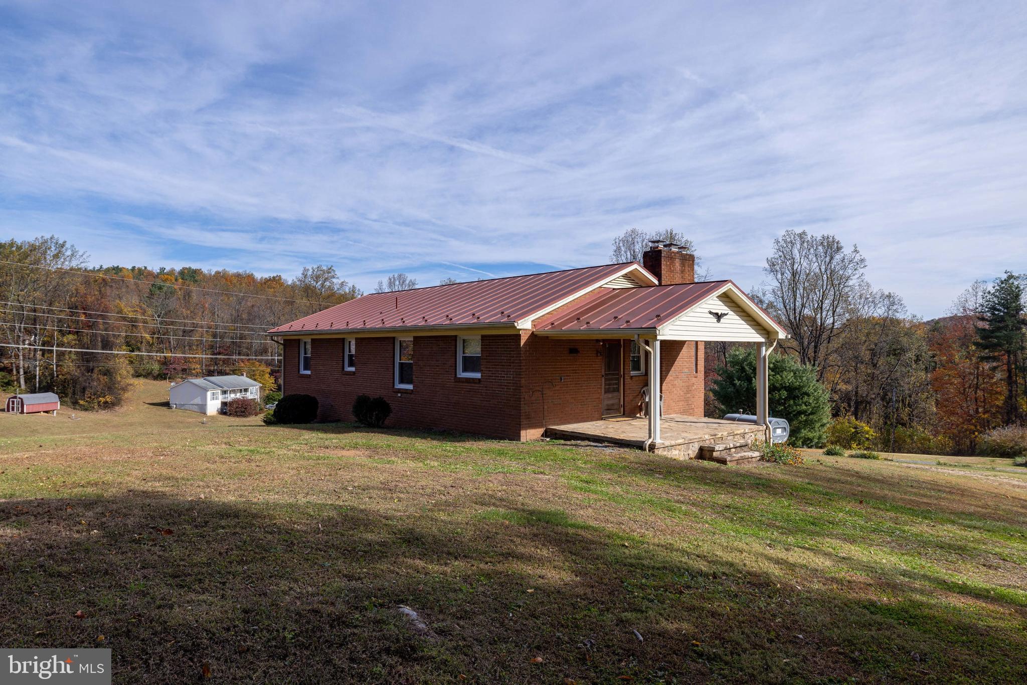 27 Atkins Road Sperryville, VA 22740 - Photo 52 of 76 a front view of a house with a yard
