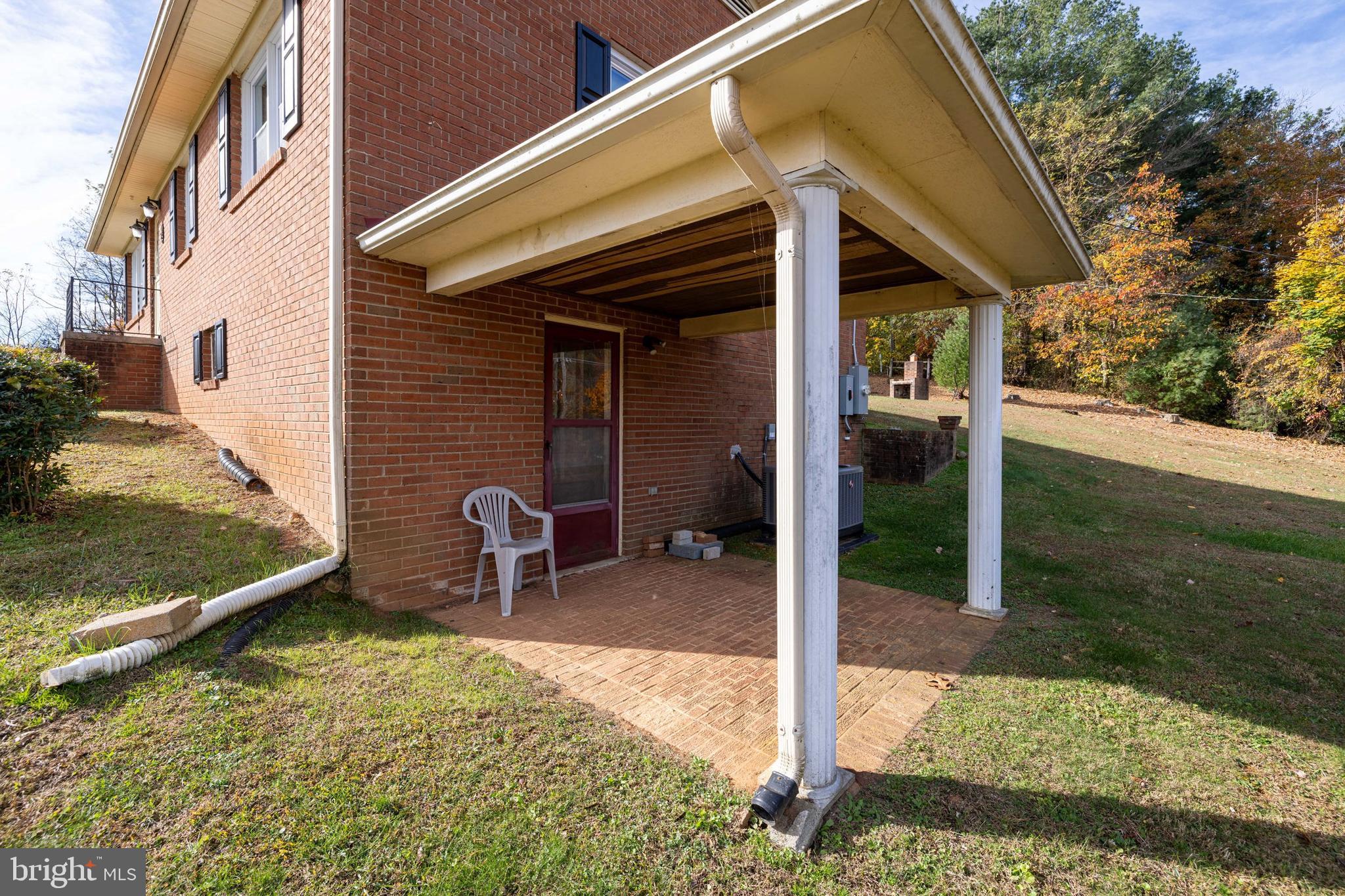 27 Atkins Road Sperryville, VA 22740 - Photo 58 of 76 a backyard of a house with barbeque oven