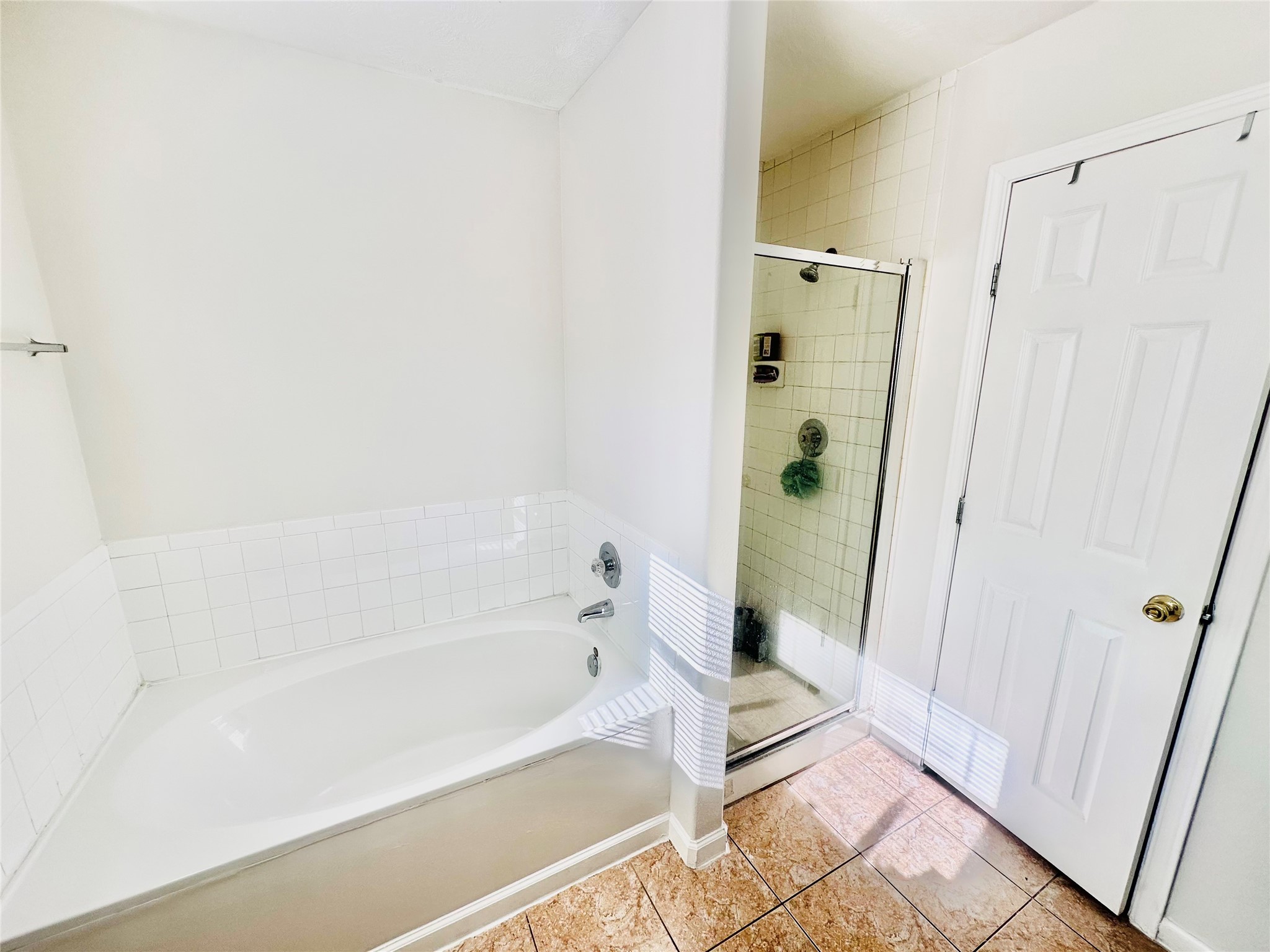 13215 Crim Road Houston, TX 77049 - Photo 11 of 20 a spacious bathroom with a bathtub and shower