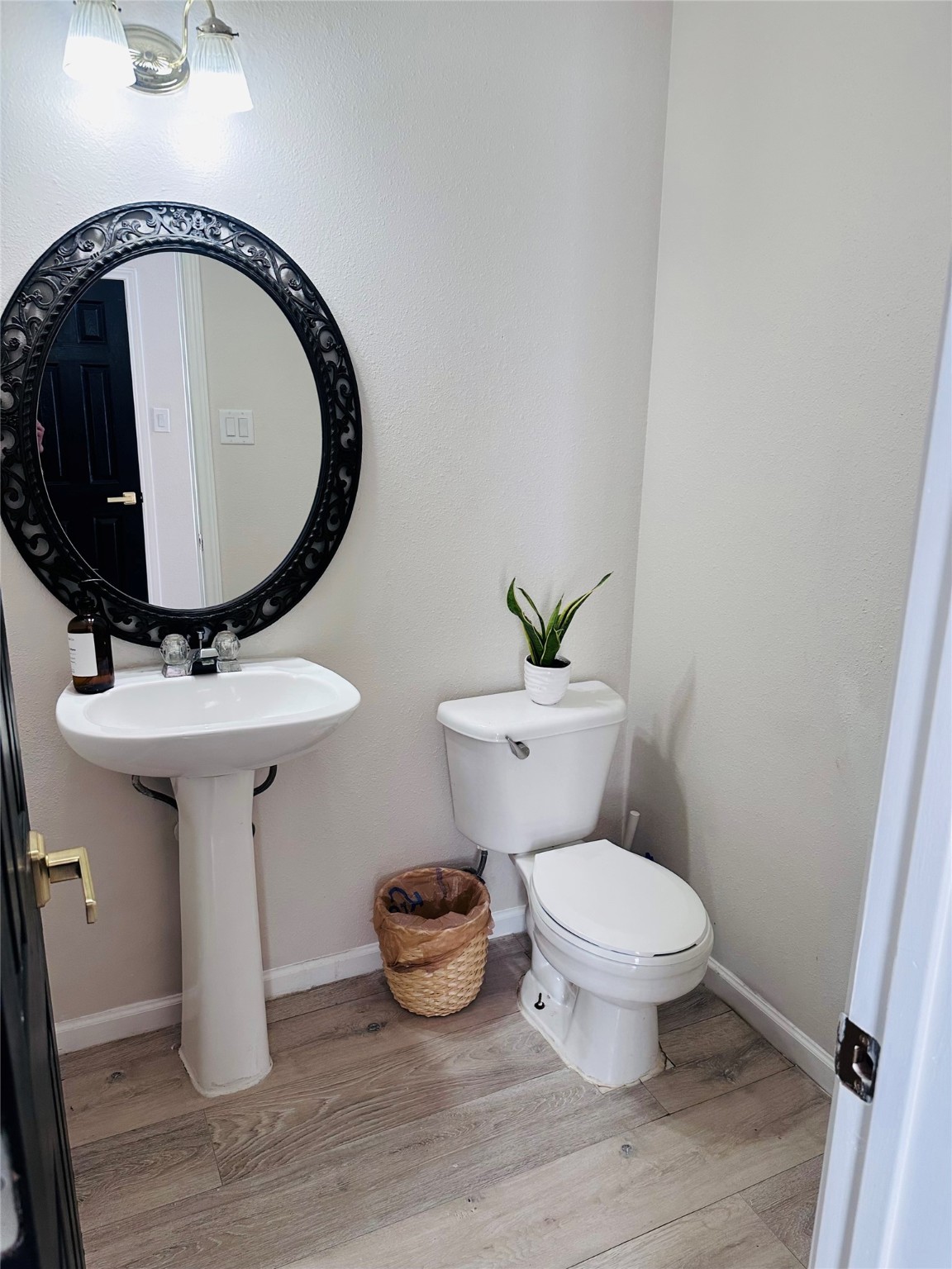 13215 Crim Road Houston, TX 77049 - Photo 12 of 20 a bathroom with a toilet sink and mirror