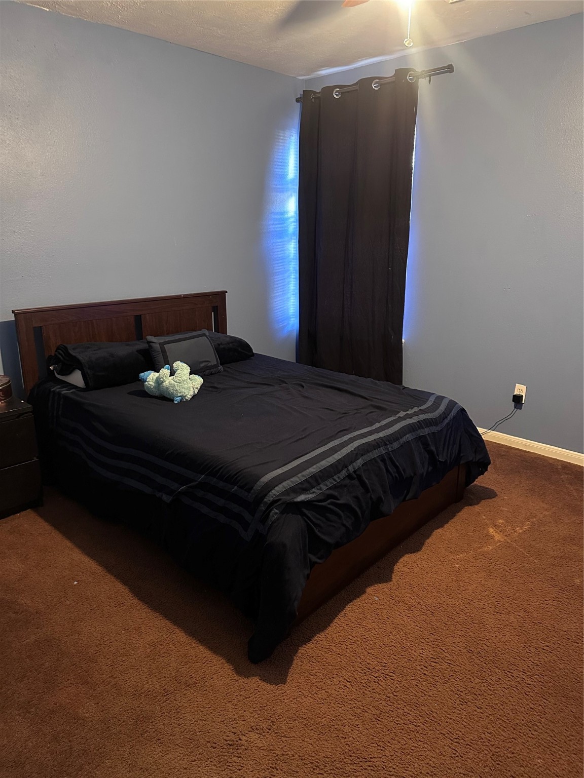 13215 Crim Road Houston, TX 77049 - Photo 15 of 20 a bed sitting in a bedroom next to a window