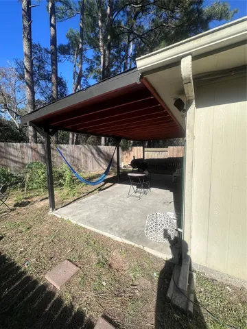 a view of a house with a yard and tree s