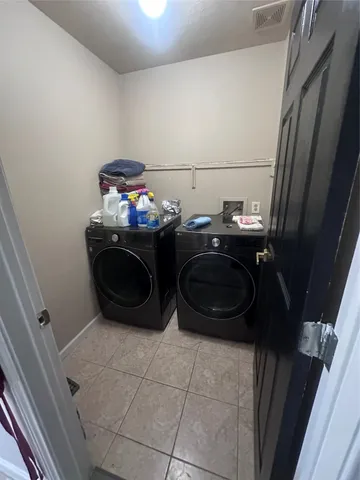 a bathroom with a toilet a sink and a window