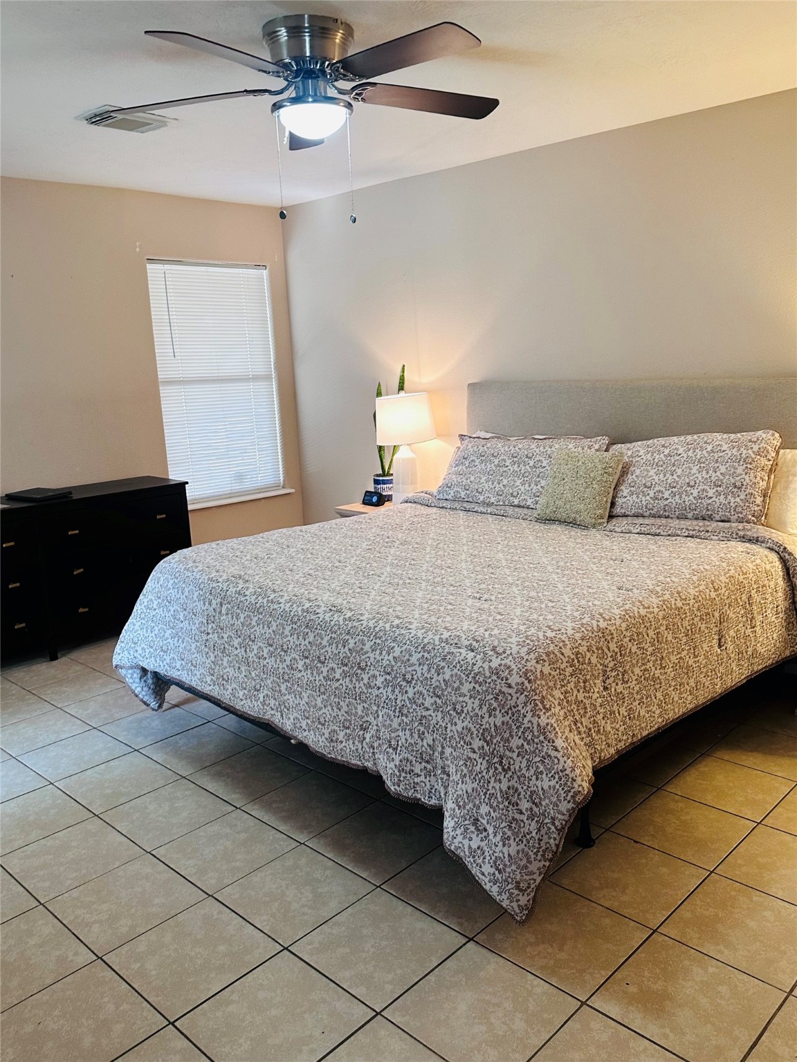 13215 Crim Road Houston, TX 77049 - Photo 9 of 20 a bedroom with a bed and a dresser