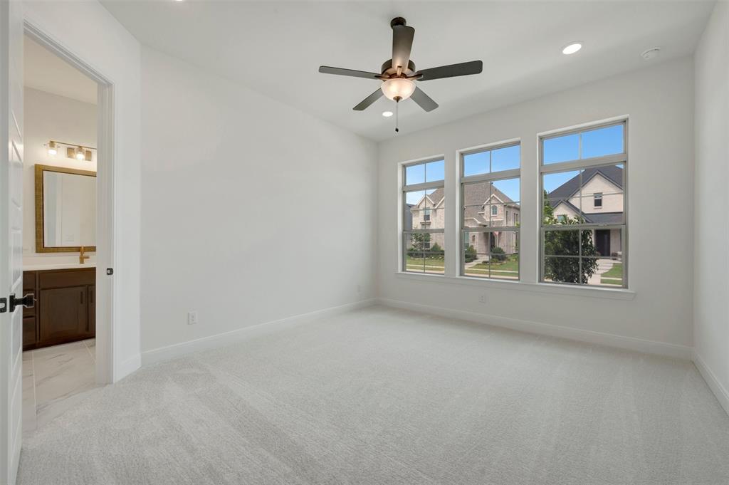 1908 Cola Drive Van Alstyne, TX 75495 - Photo 5 of 29 Carpeted room featuring three large windows, a ceiling fan, and recessed lighting