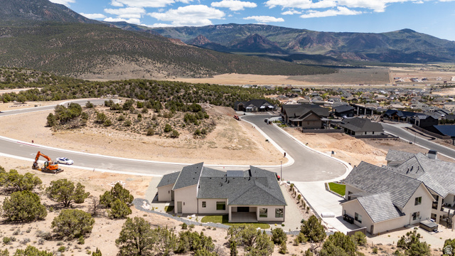 2862 South Mountain Rnch Road Cedar City, UT 84720 - Photo 61 of 64 Contemporary residence with a dark shingle roof, light-colored siding, and a covered patio