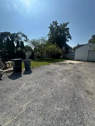 a view of outdoor space with deck and yard