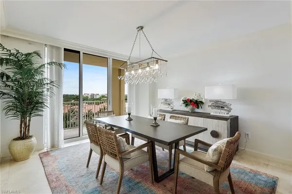 a dining room with furniture window and plants