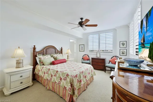 a bedroom with two beds and window