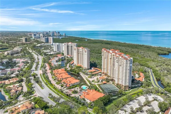 an aerial view of city and lake
