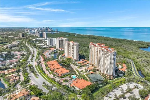 an aerial view of city and lake