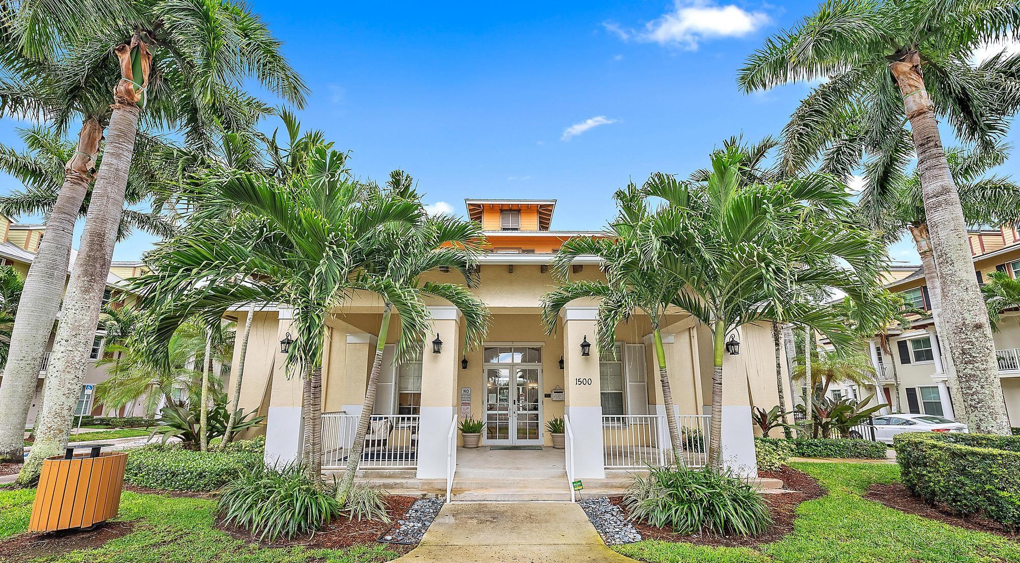 4237 East Main Street Jupiter, FL 33458 - Photo 15 of 21 a front view of a house with a yard