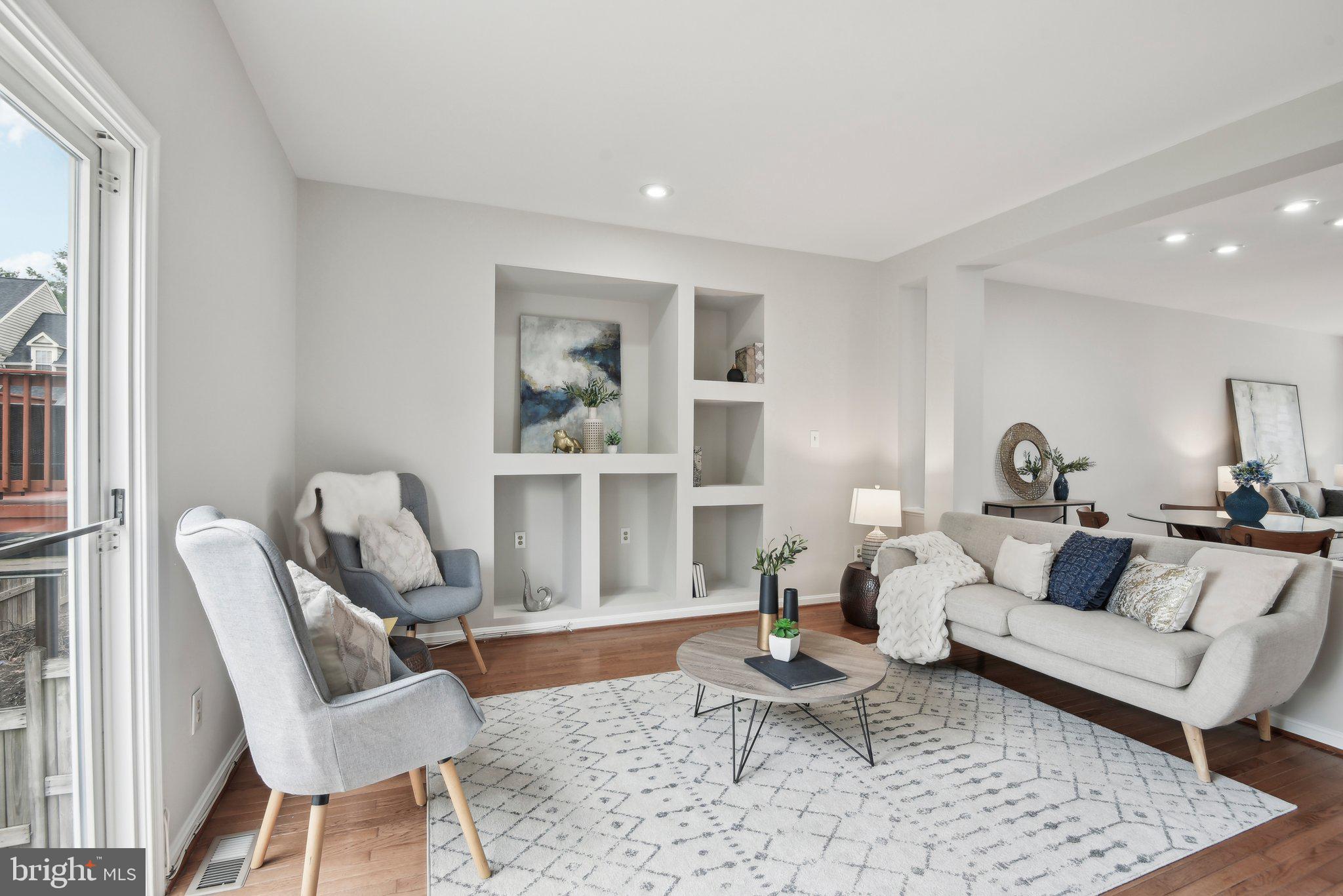 14206 Brenham Drive Centreville, VA 20121 - Photo 13 of 68 a living room with furniture and wooden floor