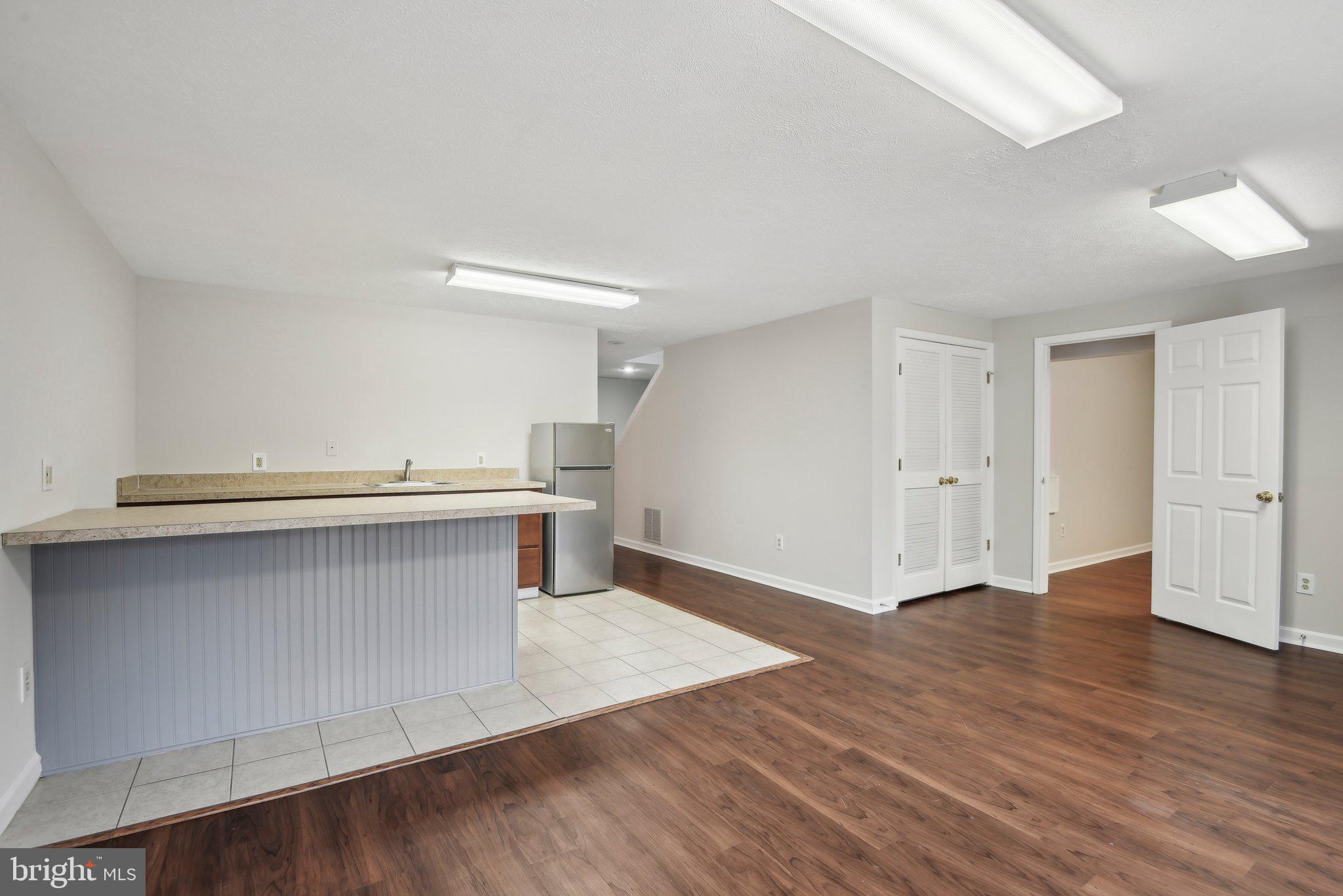 14206 Brenham Drive Centreville, VA 20121 - Photo 45 of 68 a view of kitchen with stainless steel appliances wooden floor and cabinets