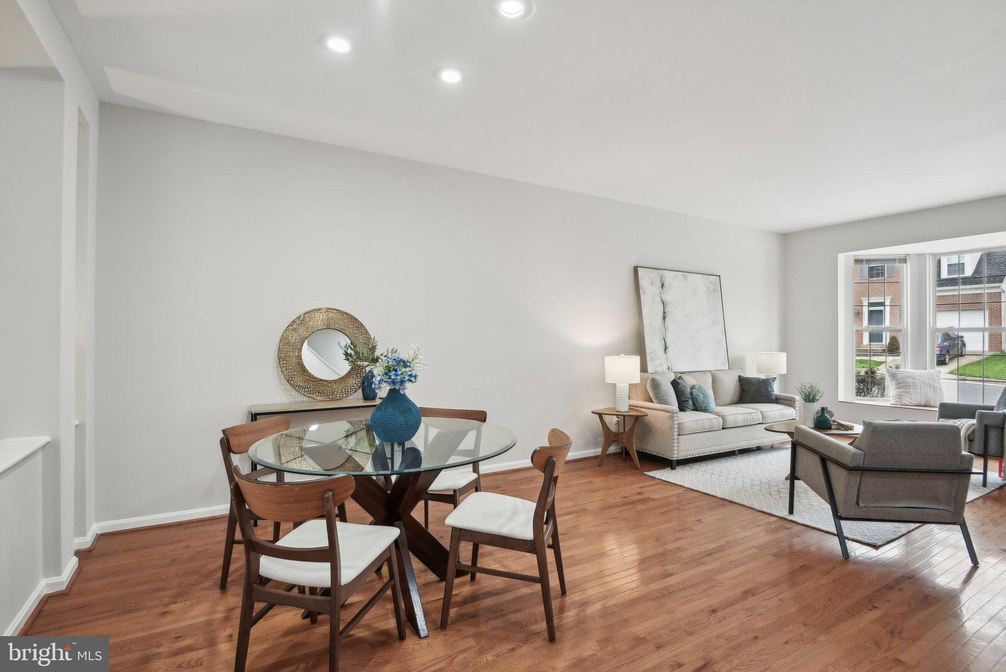 14206 Brenham Drive Centreville, VA 20121 - Photo 5 of 68 a living room with furniture a wooden floor and a window