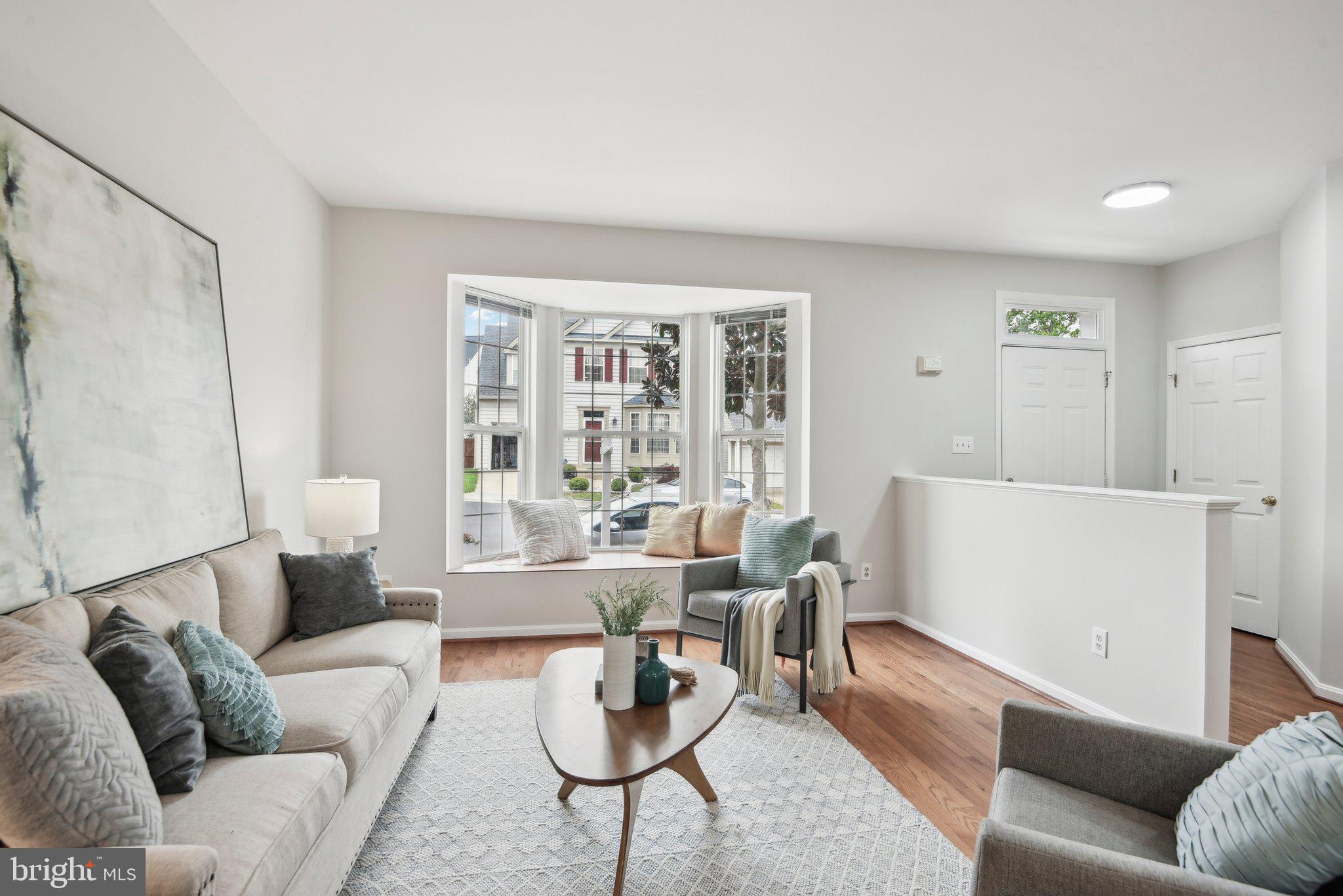 14206 Brenham Drive Centreville, VA 20121 - Photo 8 of 68 a living room with furniture and a large window