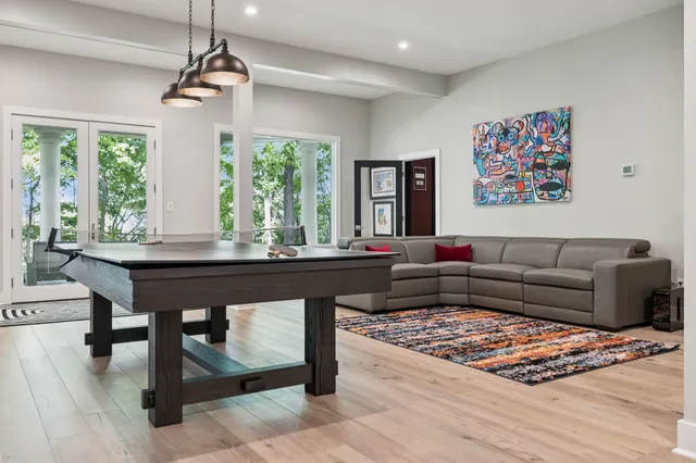 a view of a livingroom with furniture and a workspace
