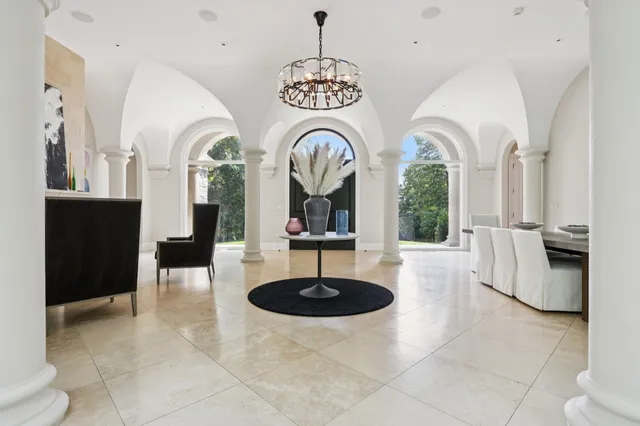 a view of living room with furniture and chandelier
