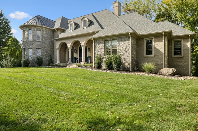 a front view of a house with a yard