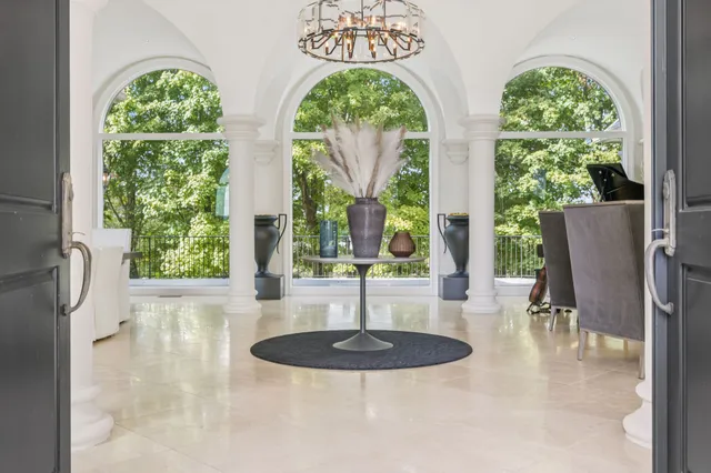 a view of hall way with furniture