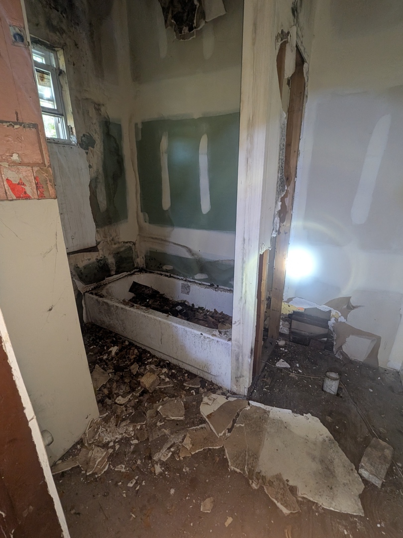 7732 South Normal Avenue Chicago, IL 60620 - Photo 13 of 29 a bathroom with a granite countertop sink a toilet and a mirror