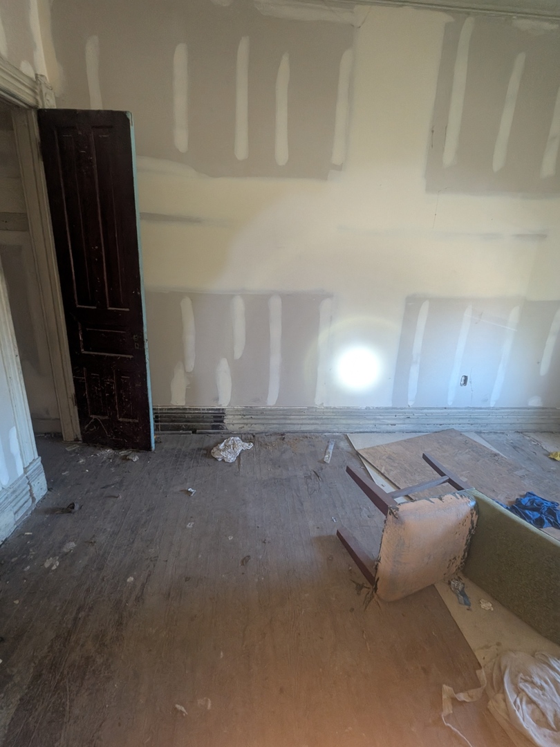7732 South Normal Avenue Chicago, IL 60620 - Photo 10 of 29 a room with water heater and wooden cabinets